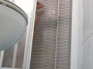 Spying on voluptuous Wife Shaving Pussy in Shower
