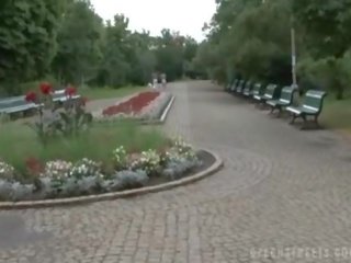Charming amateur gets naked in a park for money